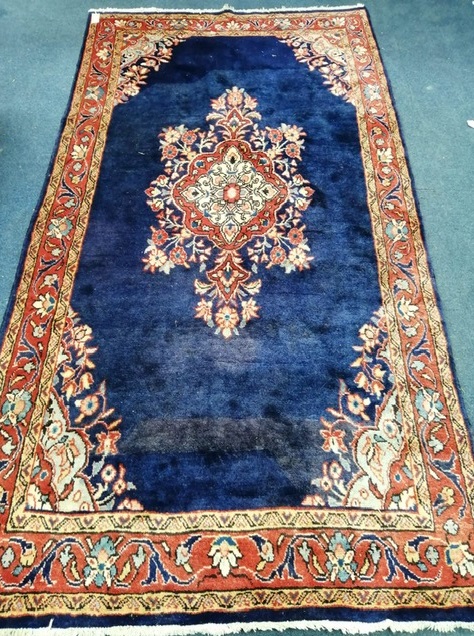 A North West Persian blue ground hall carpet 245 x 128cm